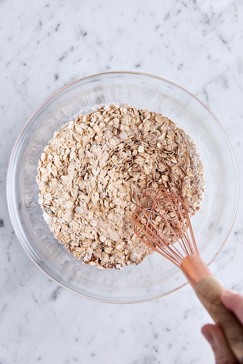 Rolled oats, flour, brown sugar, cinnamon, and salt whisked together in glass bowl