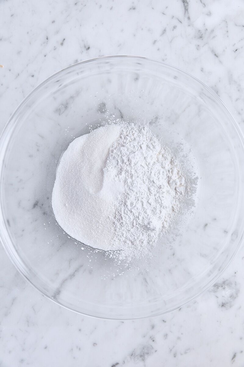 Granulated sugar, arrowroot starch, and salt in glass bowl