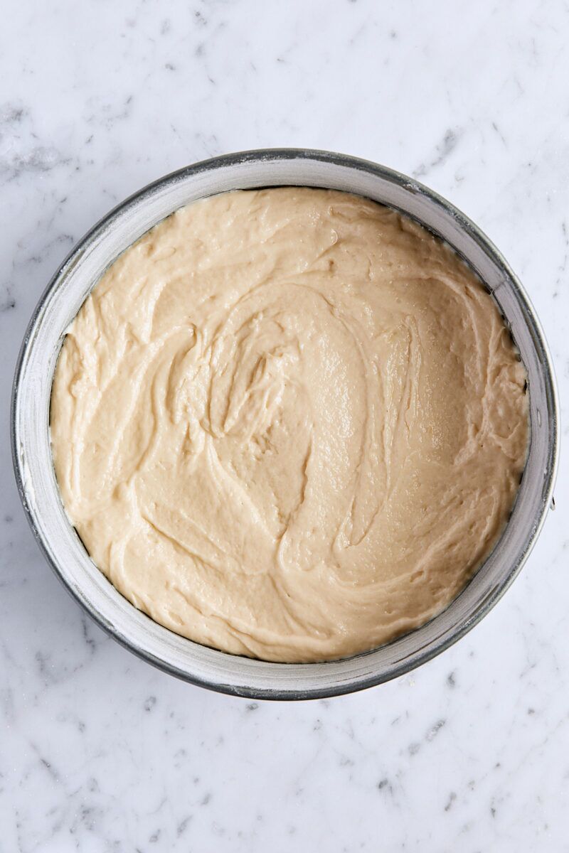 Half of the coffee cake batter in springform pan