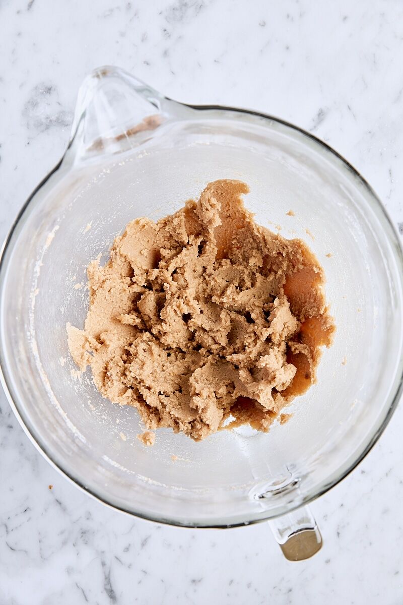 Butter and sugars mixed until soft and creamy in glass mixing bowl