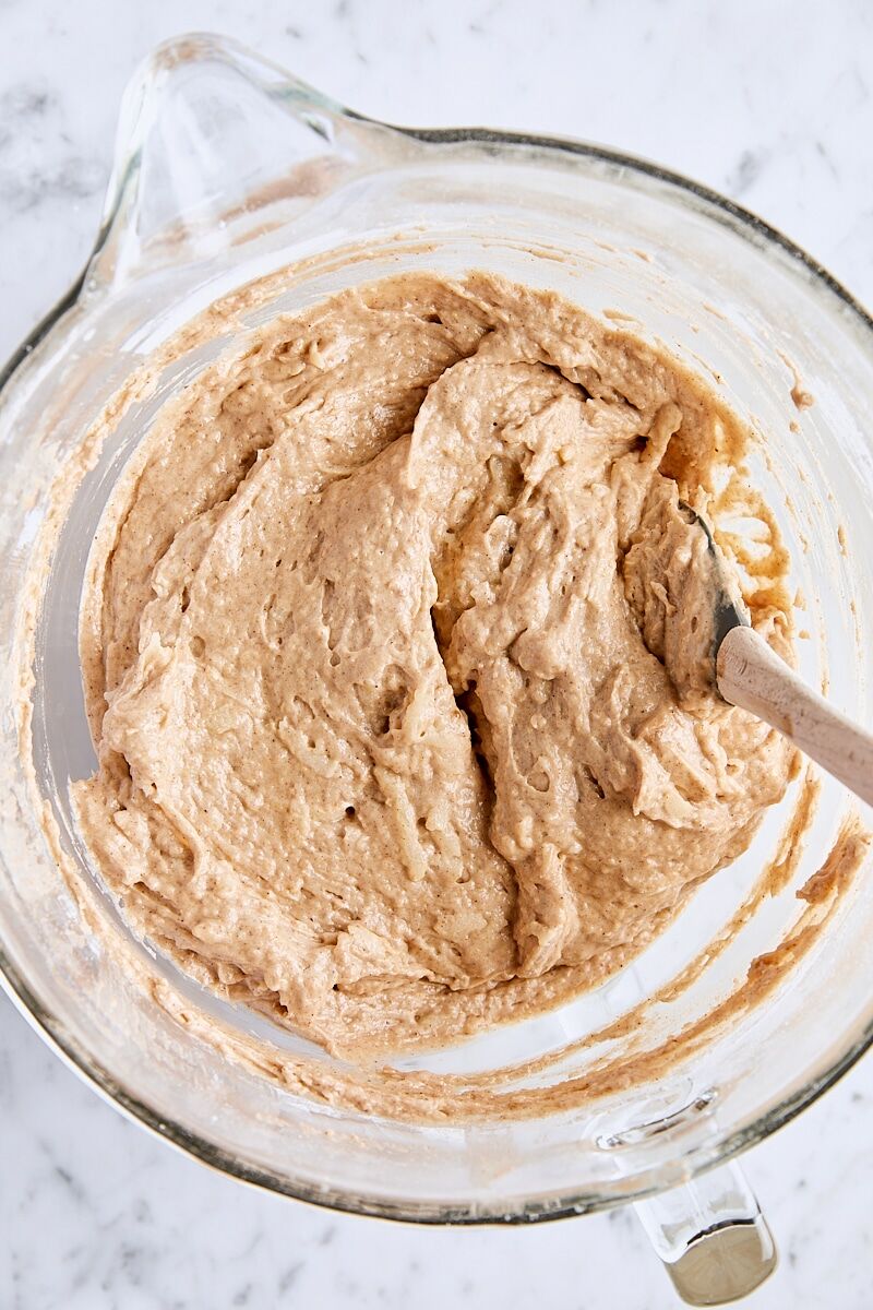 Spice bundt cake batter in glass bowl with spatula