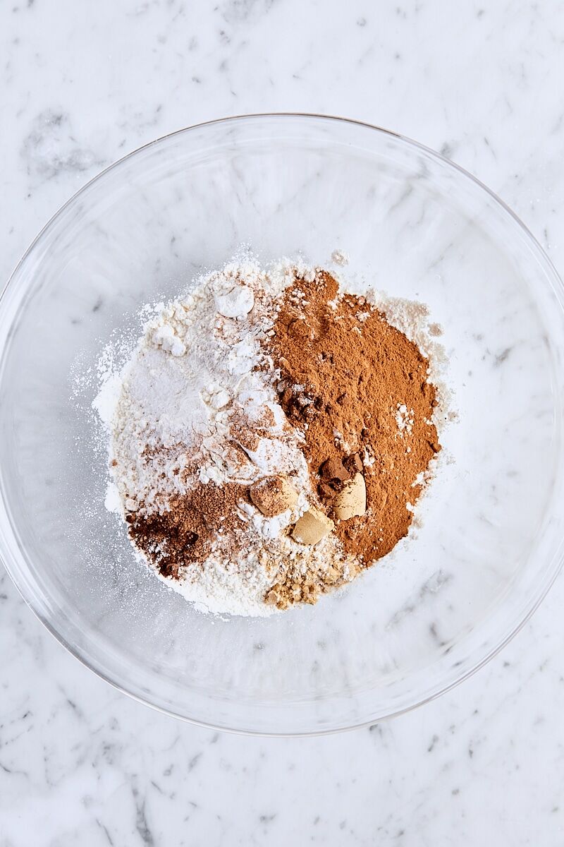 All-purpose flour, baking powder, baking soda, spices, and salt in large glass bowl
