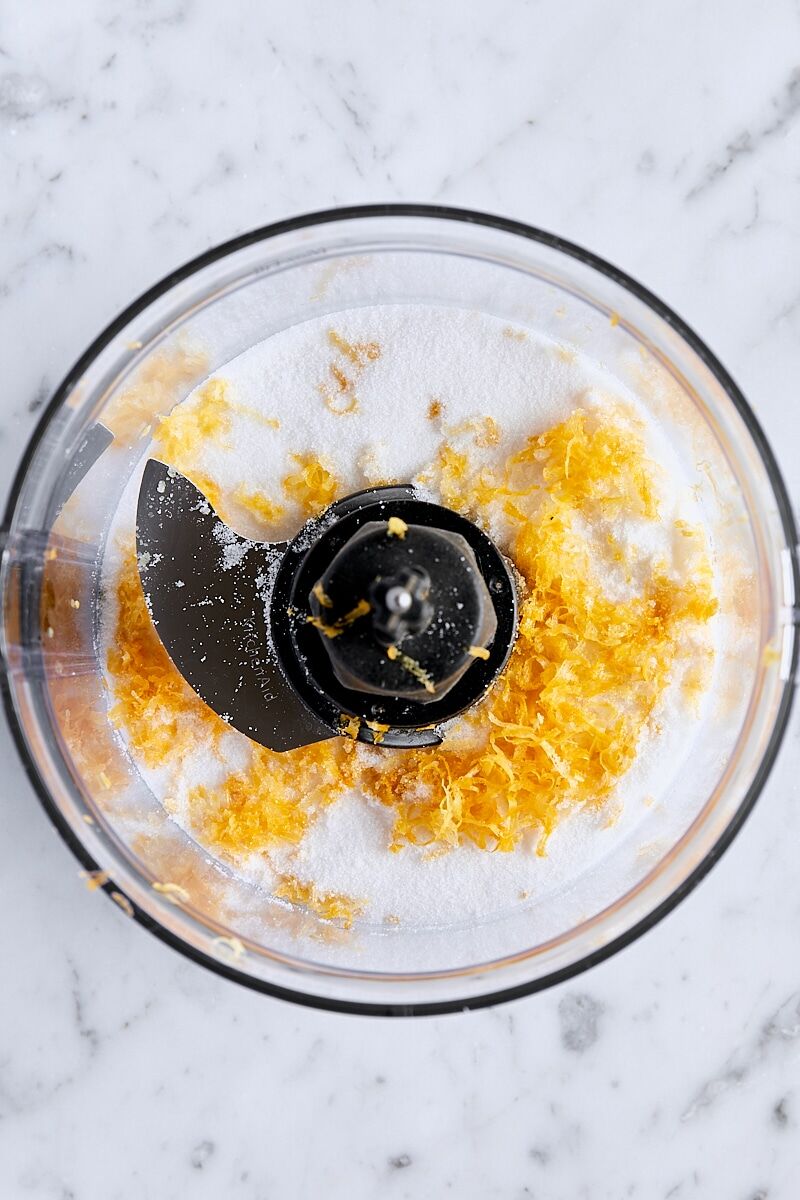 Lemon zest and granulated sugar in food processor