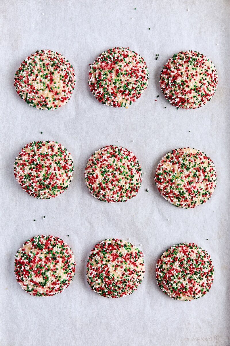 Baked brown butter sugar cookies on parchment-lined baking sheet