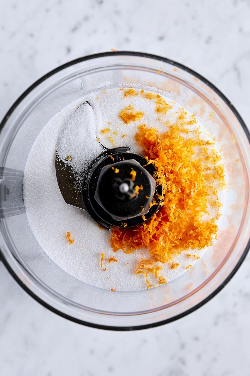 Orange zest and granulated sugar in food processor