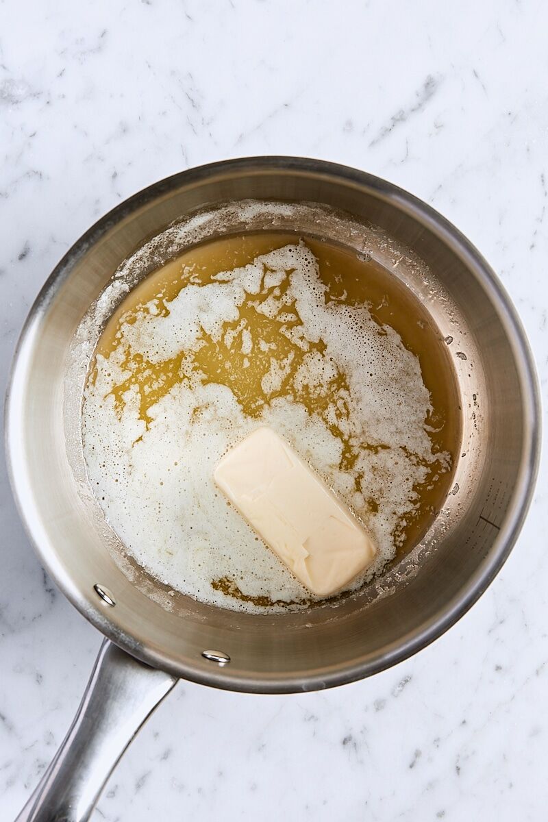 Unsalted butter melting in medium saucepan