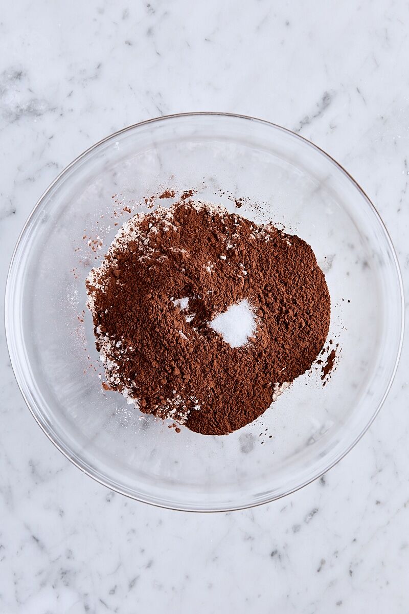 Flour, Dutch process cocoa powder, baking soda, and salt in medium glass bowl