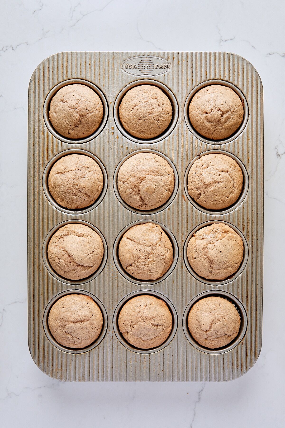 Baked donut muffins in muffin tin