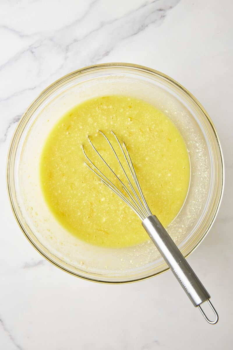 Wet ingredients whisked together in glass bowl