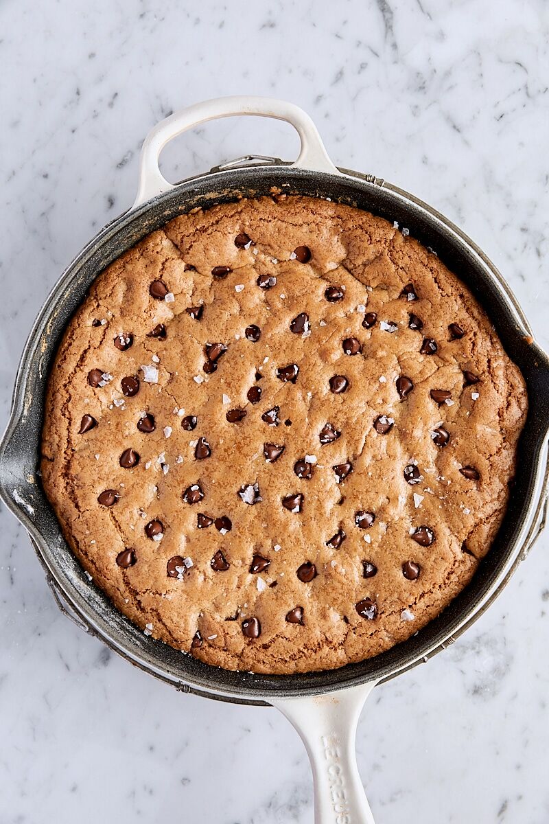 Baked skillet cookie topped with flaky salt