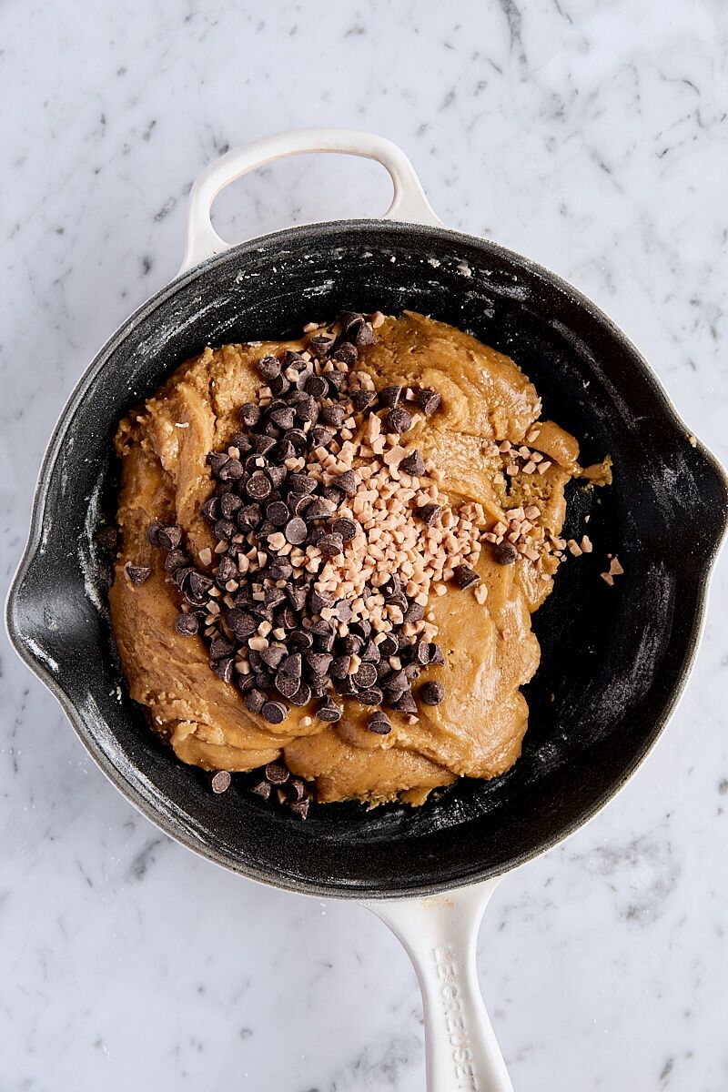 Chocolate chips and toffee bits added to dough