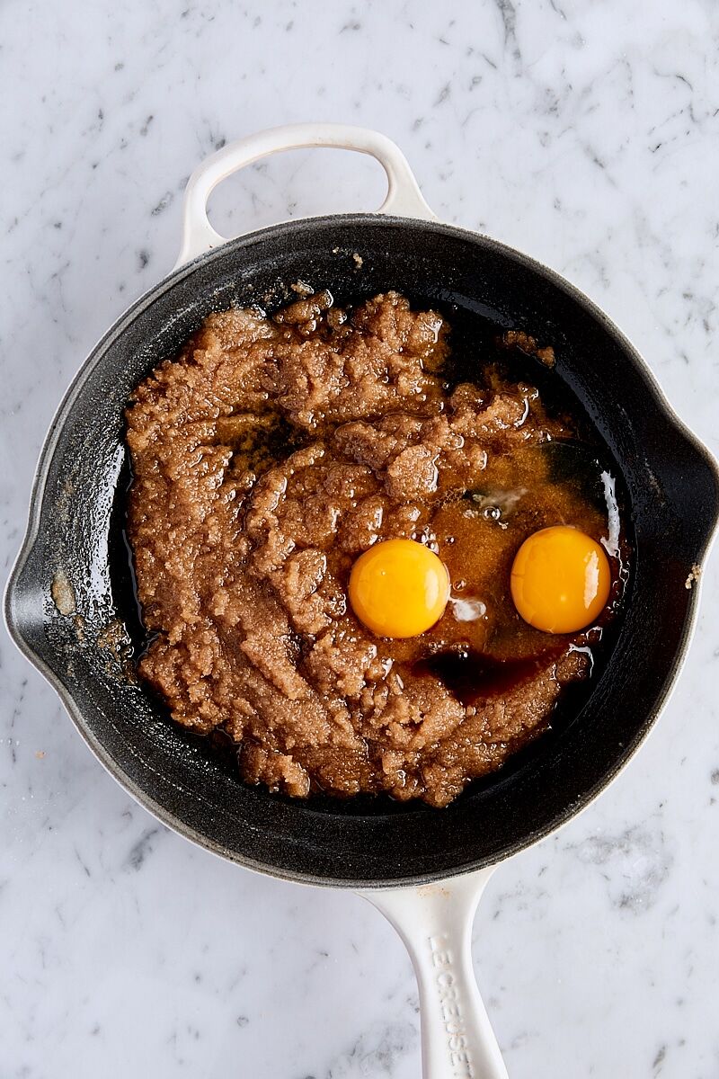 Egg, egg yolk, and vanilla extract added to sugar mixture