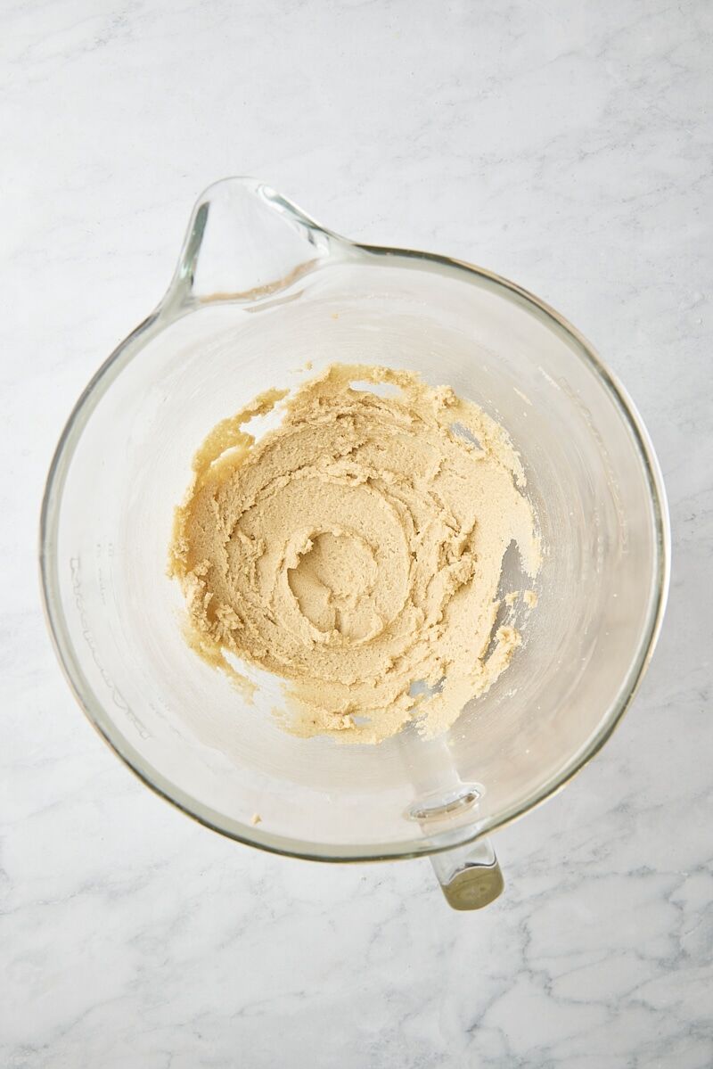 Butter and sugars mixed until soft and creamy in glass mixing bowl