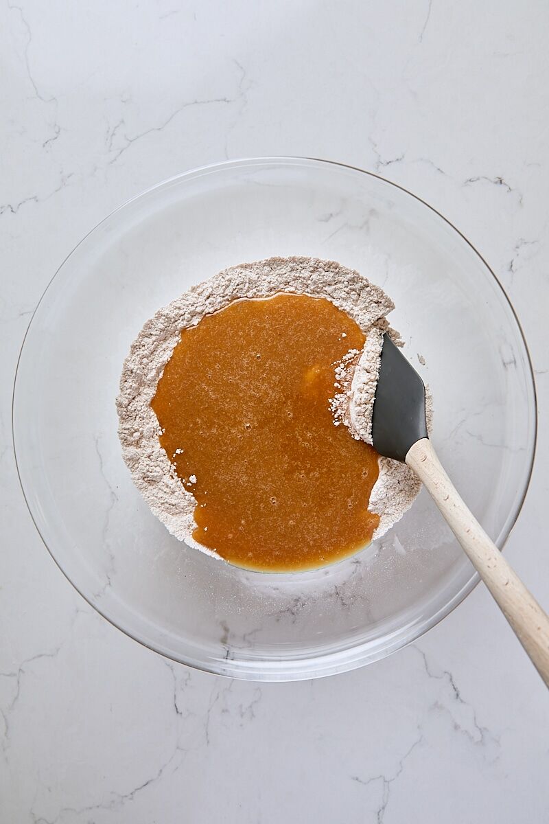Applesauce mixture added to flour mixture