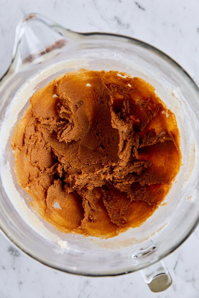 Molasses added to dough in glass mixing bowl