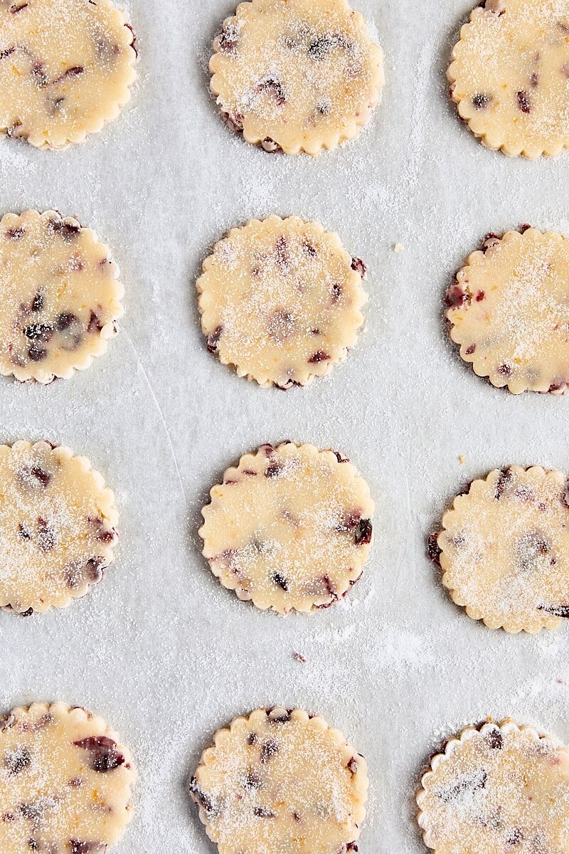 Rounds of shortbread dough on parchment-lined baking sheet
