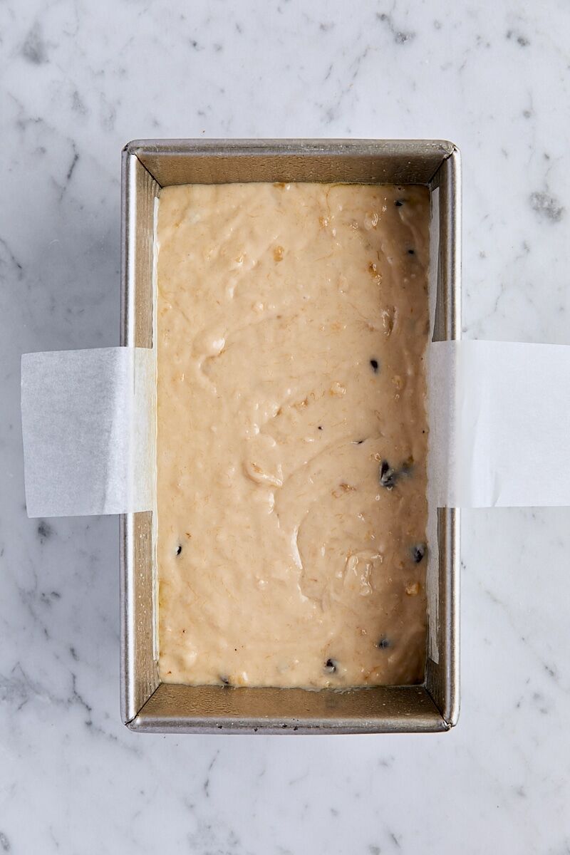 Banana bread batter in parchment-lined loaf pan