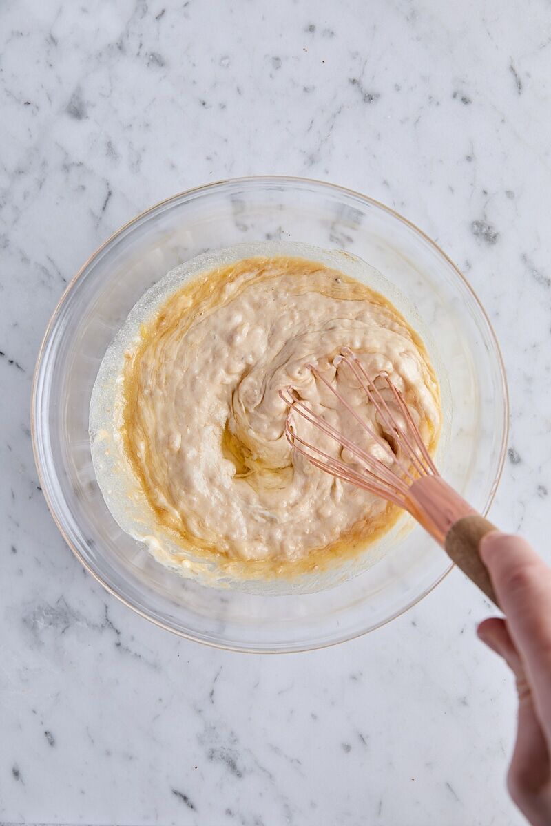 Wet ingredients whisked together in glass bowl