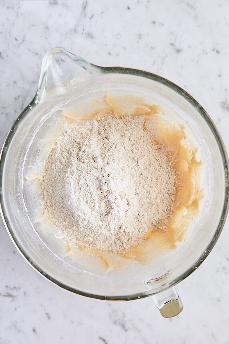 Remaining flour added to dough in glass mixing bowl