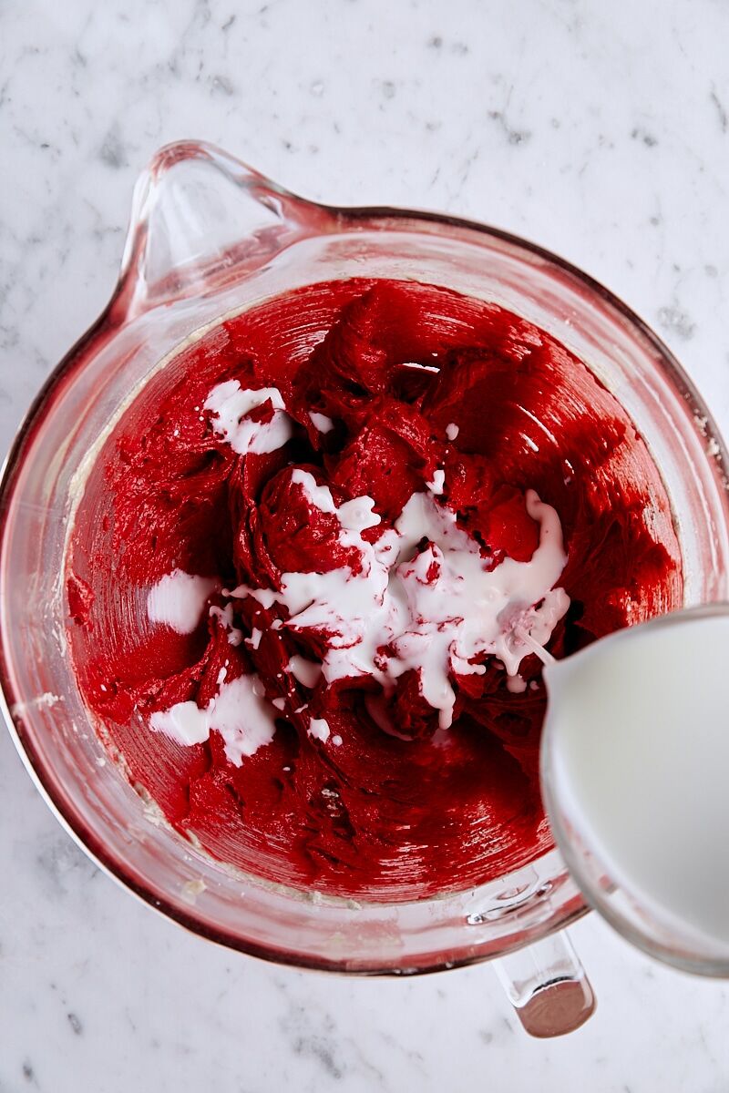 Buttermilk added to batter in glass mixing bowl