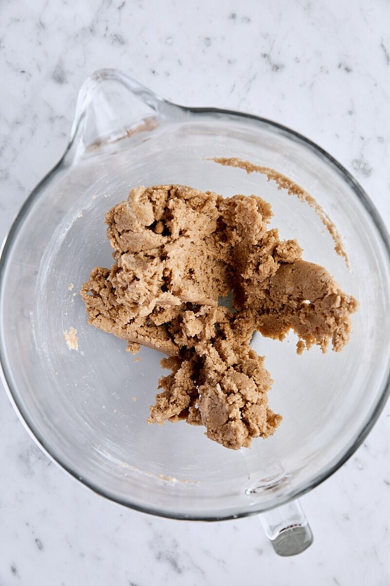Butter, light brown sugar, and granulated sugar mixed together in glass mixing bowl