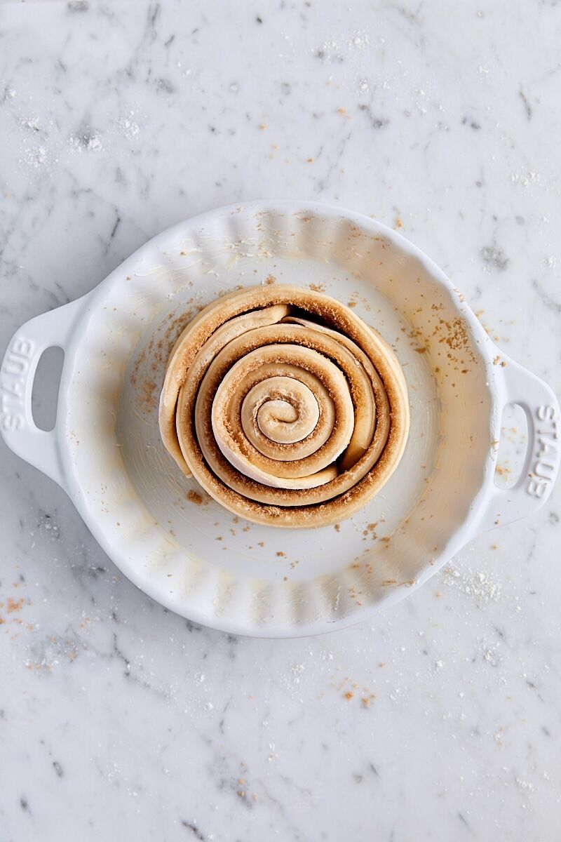 Spiraled dough strips in white ceramic baking dish