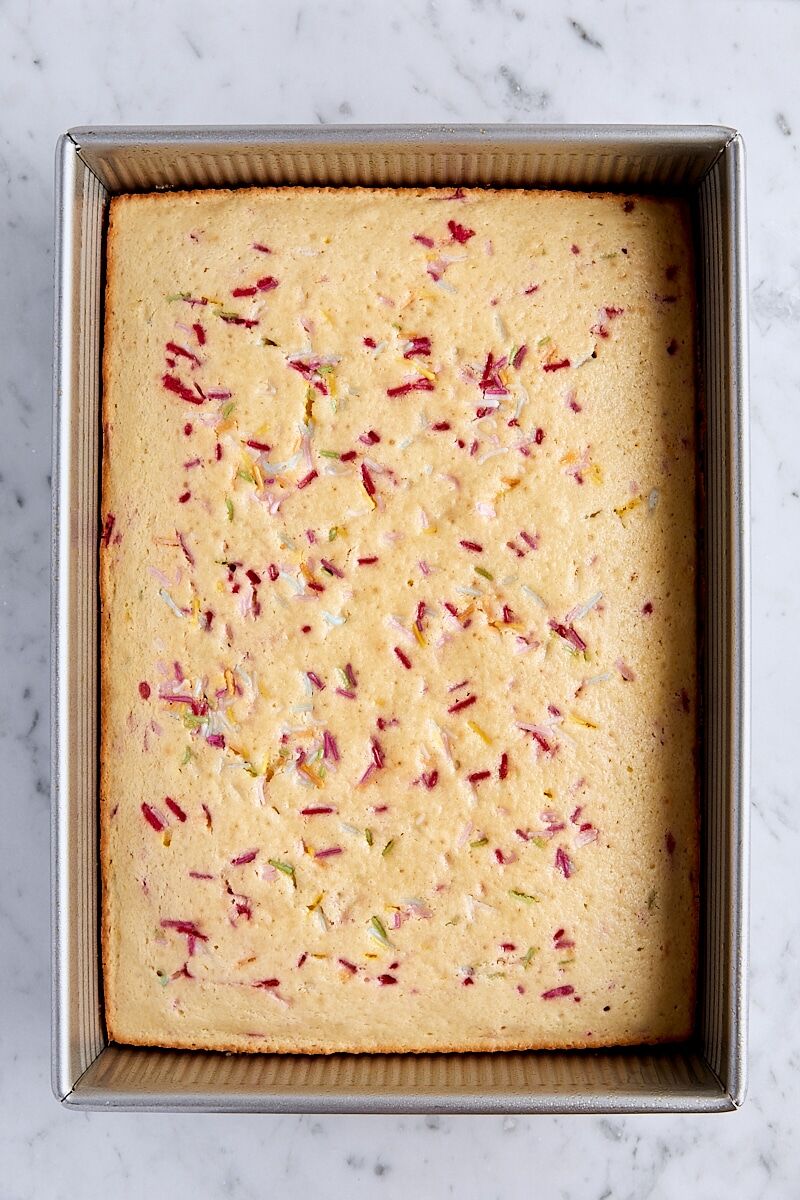 Baked funfetti sheet cake in 13 x 9-inch rectangular baking pan