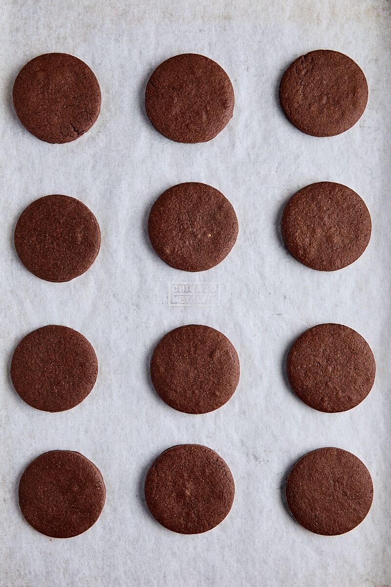 Baked thin mint cookies on parchment-lined baking sheet
