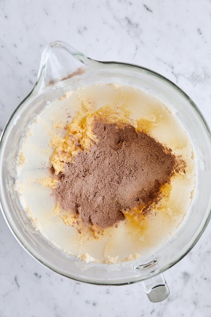 Dry ingredients added to dough in glass mixing bowl