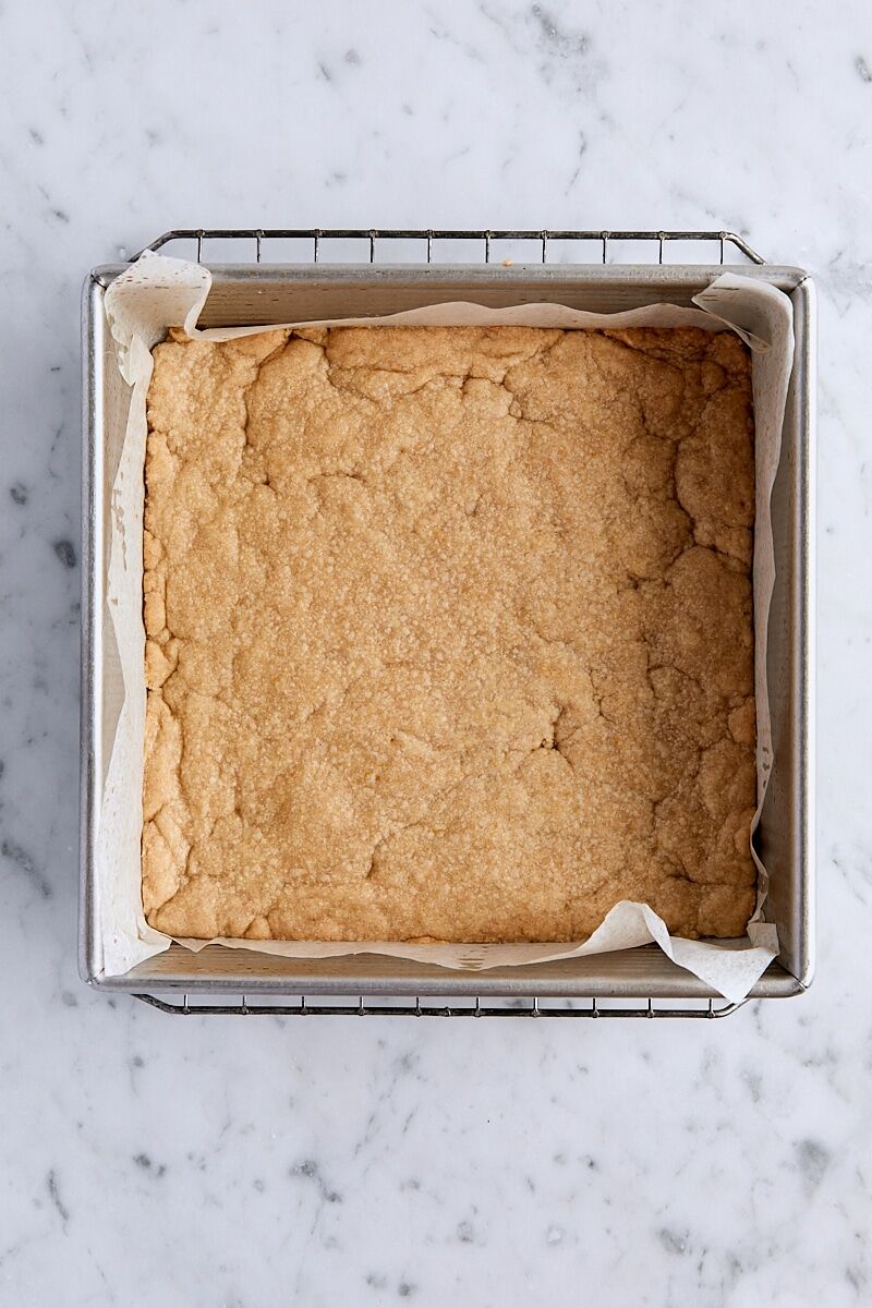 Crust par-baked until golden and set in parchment-lined baking pan