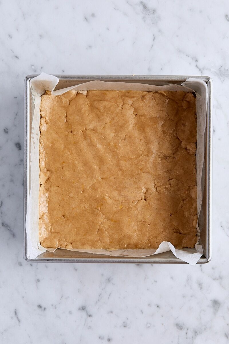 Crust mixture pressed evenly into parchment-lined 8-inch square baking pan