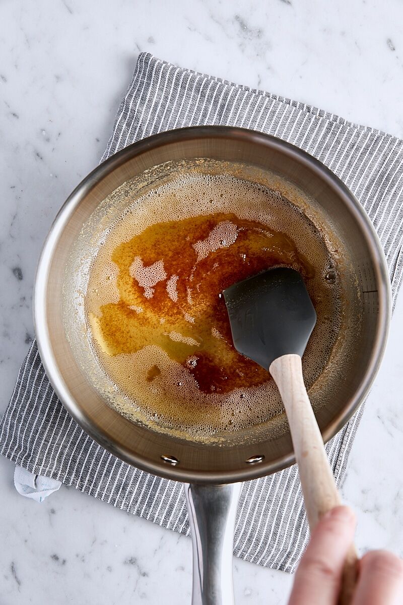 Melted butter browning in saucepan with spatula