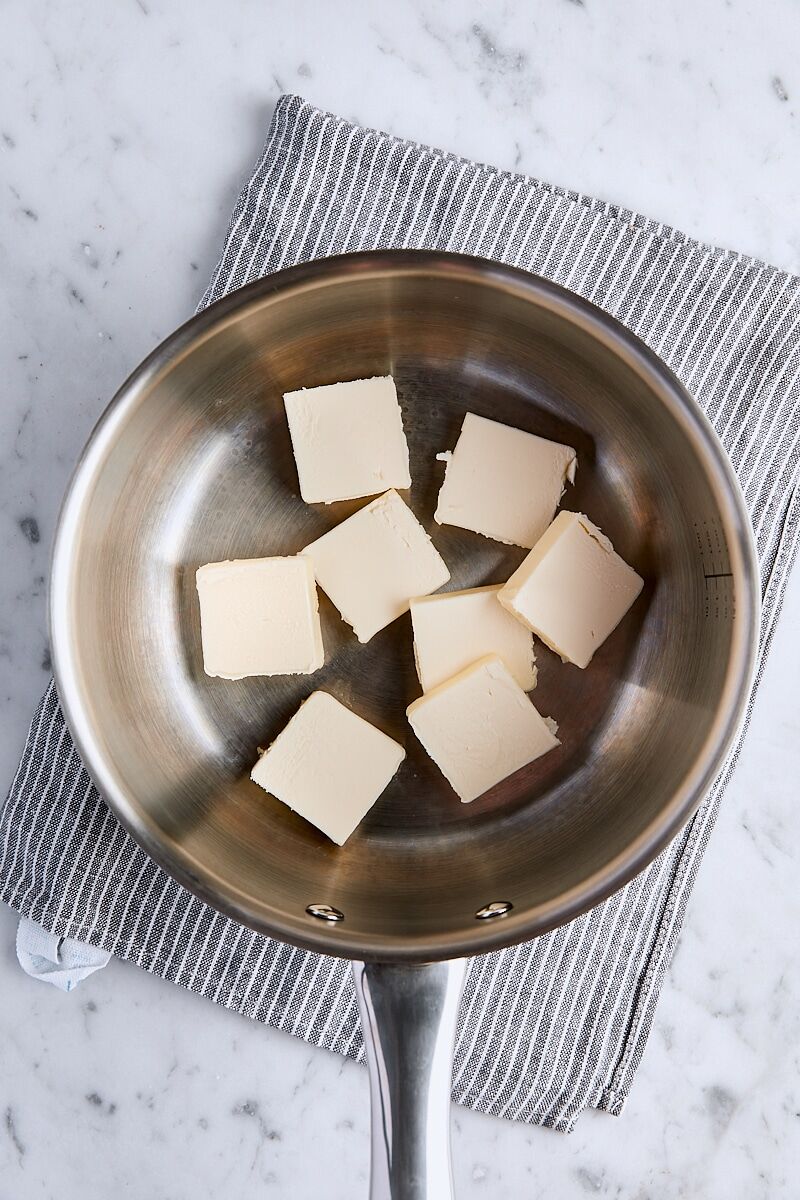 Sliced unsalted butter in saucepan