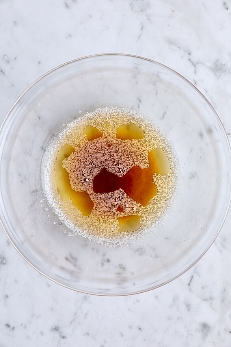 Melted brown butter in glass bowl
