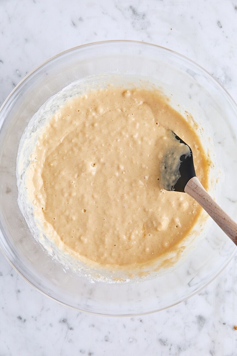 Mixed batter for yeast waffles in large glass bowl