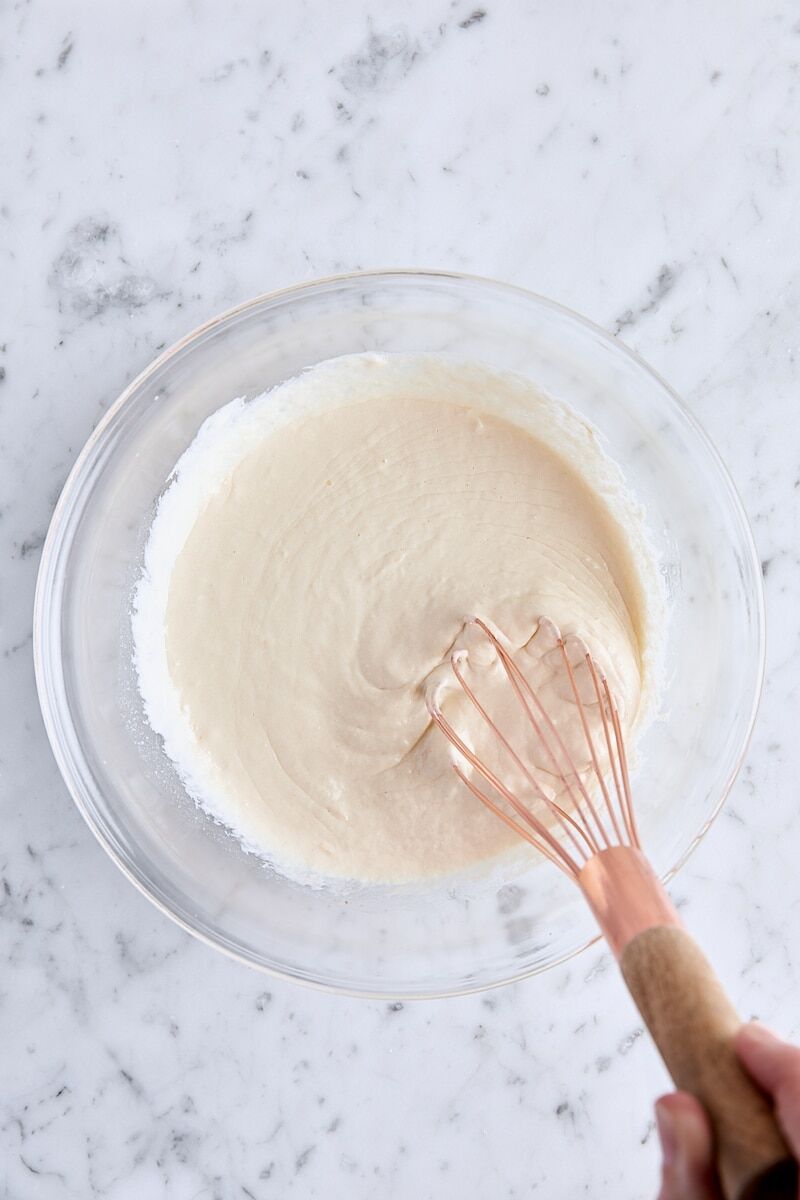 Wet ingredients whisked together in glass bowl