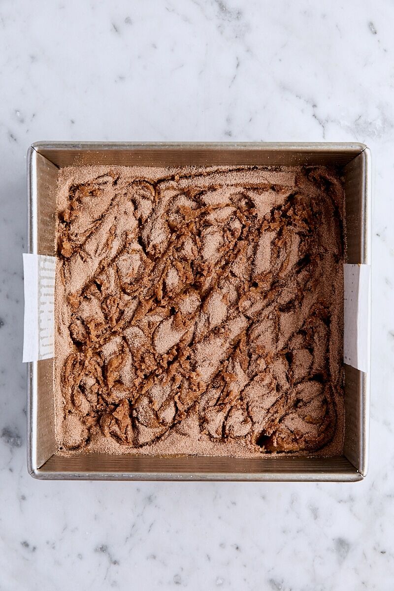 Cinnamon-sugar swirled into blondie batter in parchment-lined square pan