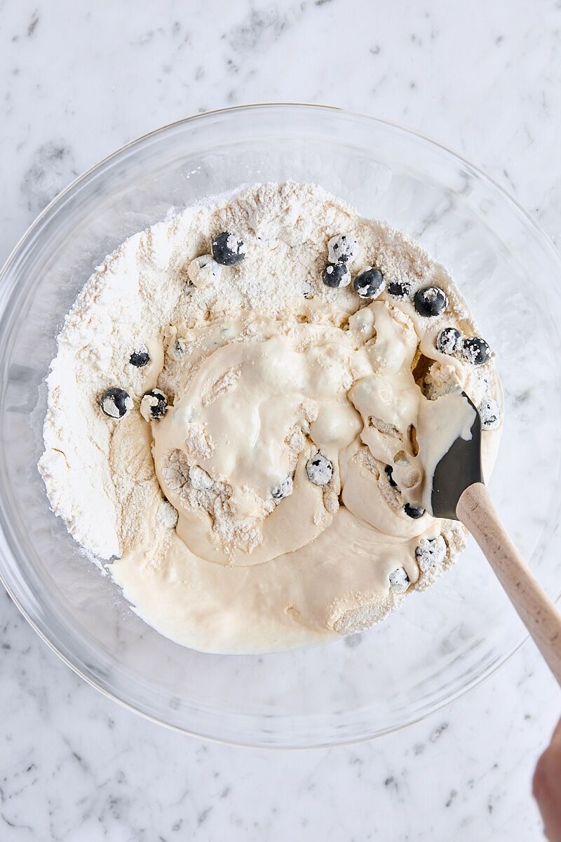 Wet ingredients folded into dry ingredients with a spatula