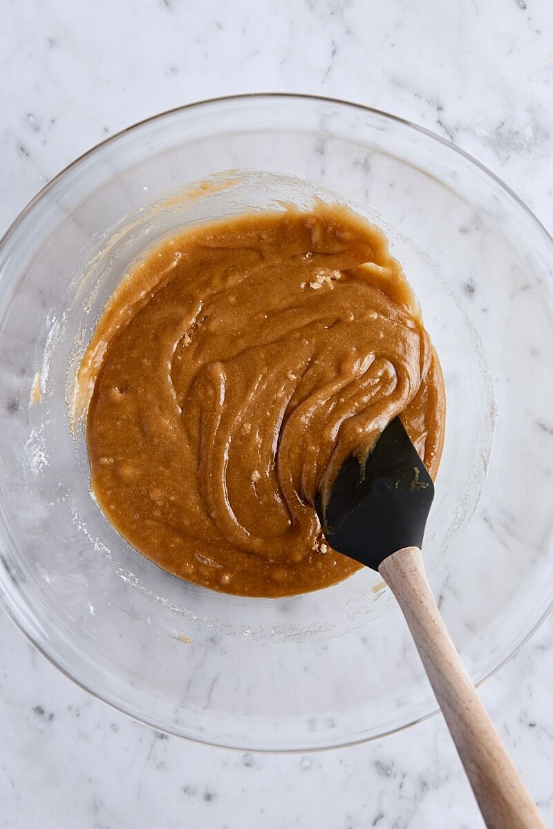 Snickerdoodle blondie batter in glass bowl with spatula