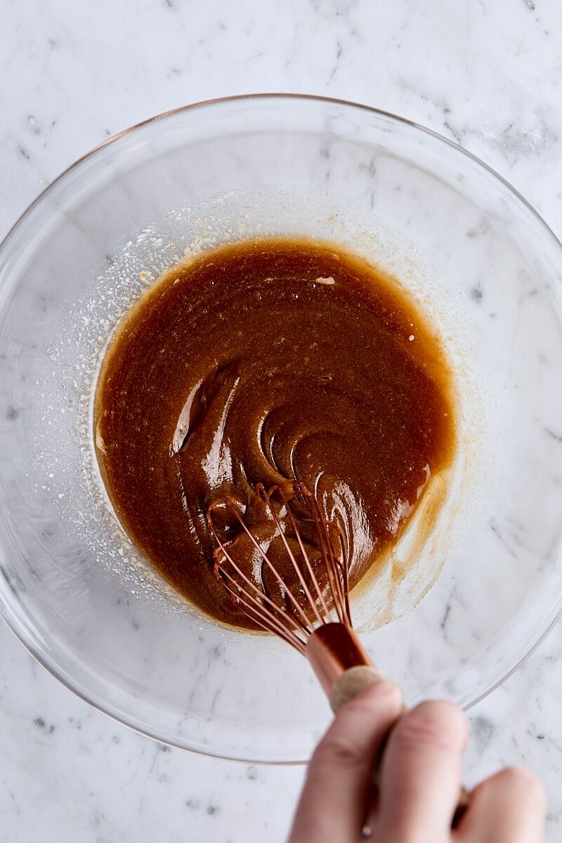 Wet ingredients whisked together in glass bowl