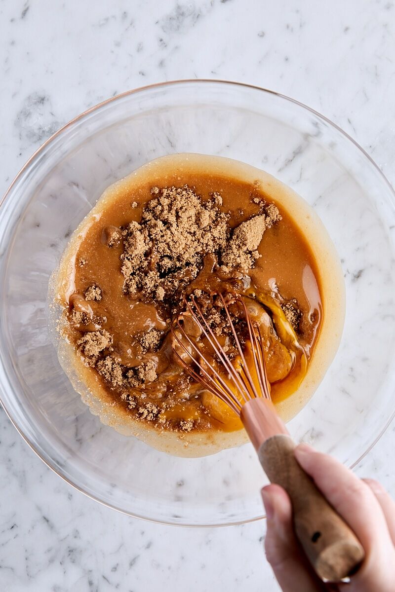 Whisking wet ingredients together in glass bowl