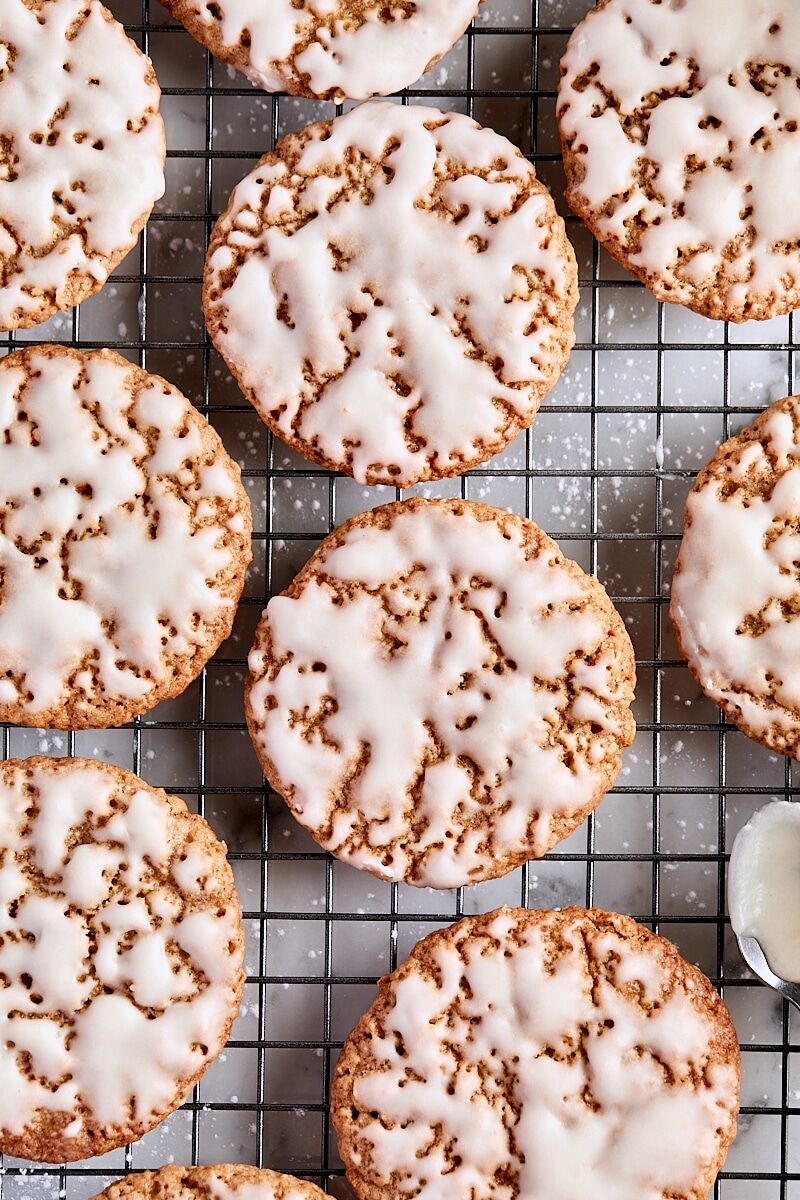 Iced oatmeal cookies on a wire cooling rack