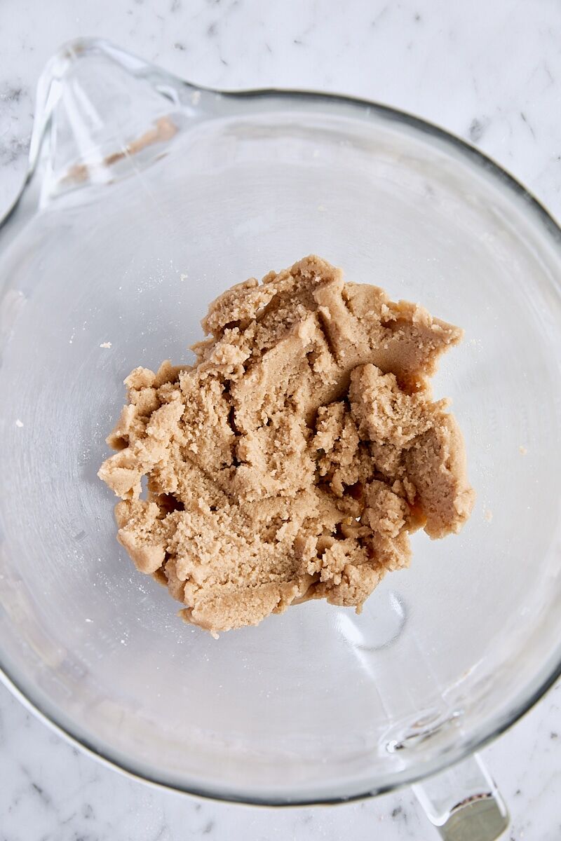 Butter, brown sugar, and granulated sugar mixed until creamy in glass mixing bowl