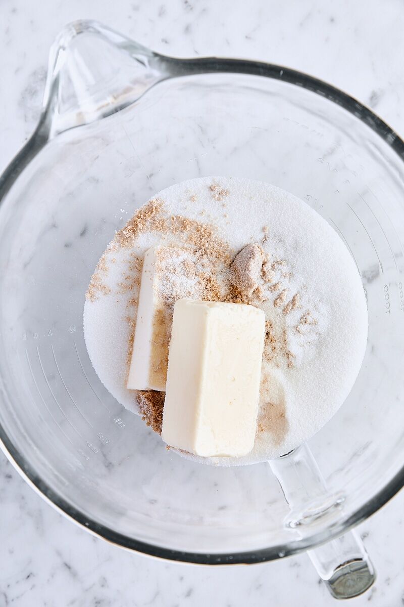 Room temperature butter, dark brown sugar, and granulated sugar in glass mixing bowl
