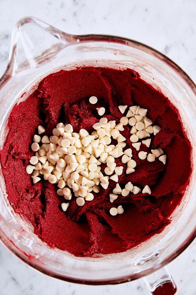 White chocolate chips added to red velvet cookie dough