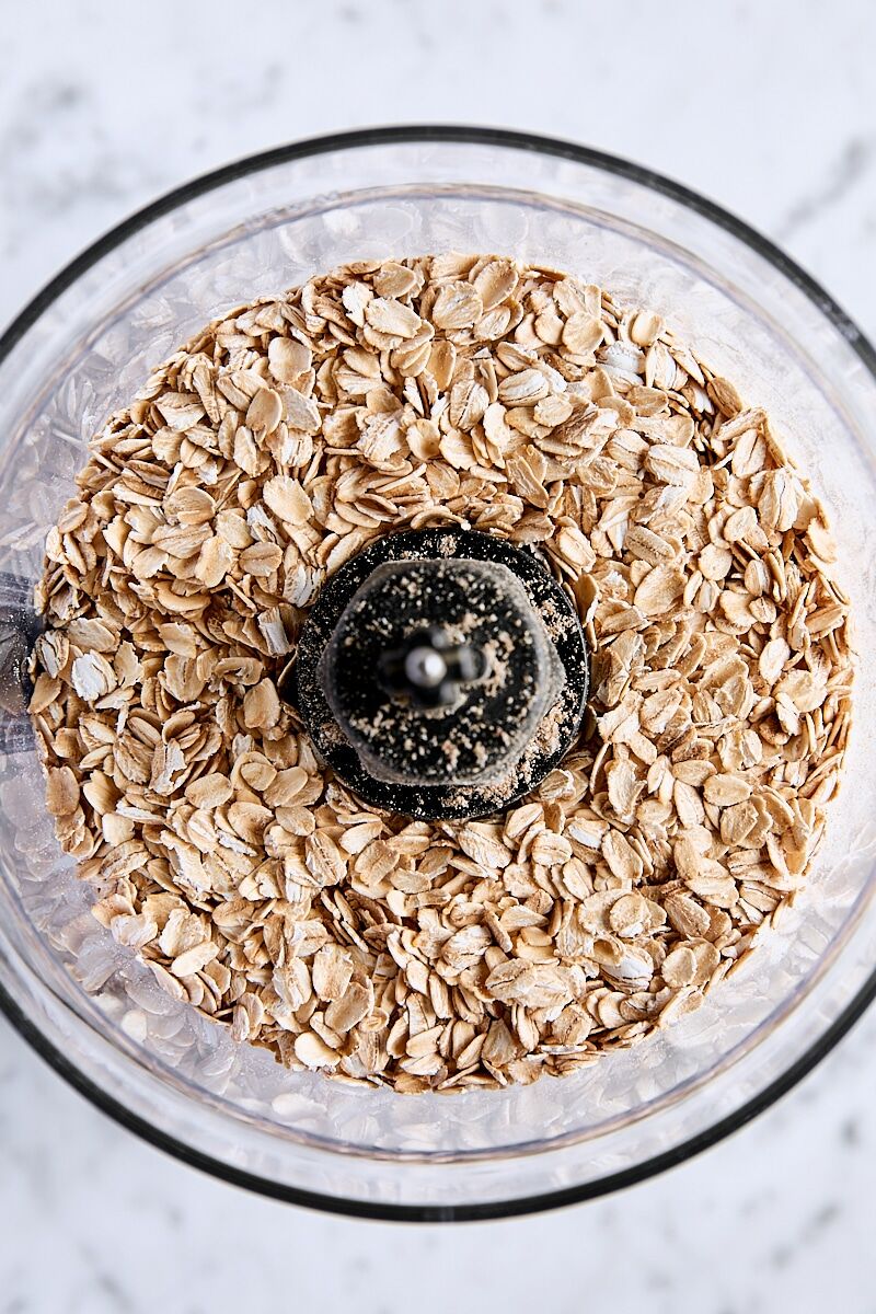 Old fashioned rolled oats in the bowl of a food processor