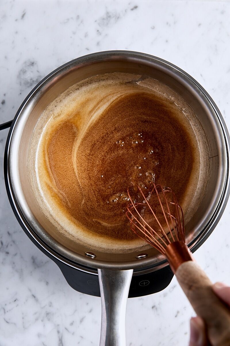 Whisked butterscotch sauce ingredients in saucepan