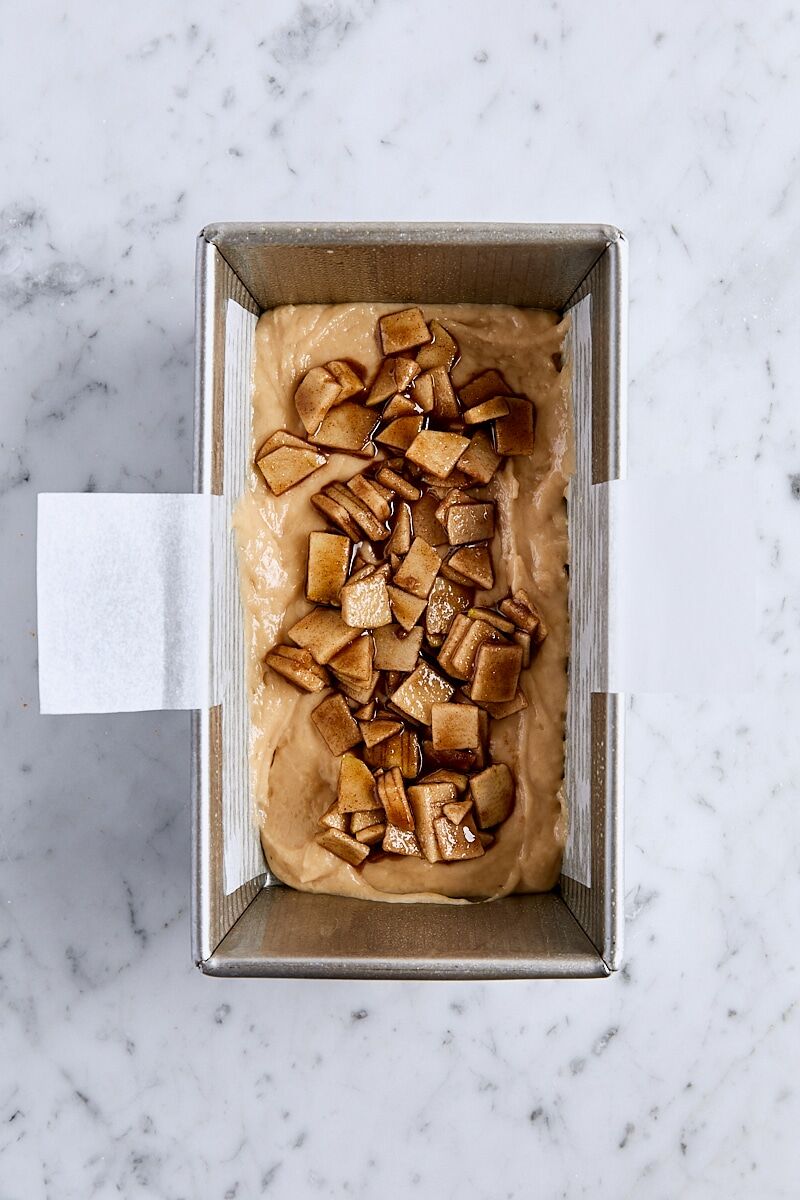 Apple fritter batter topped with brown sugar-apples