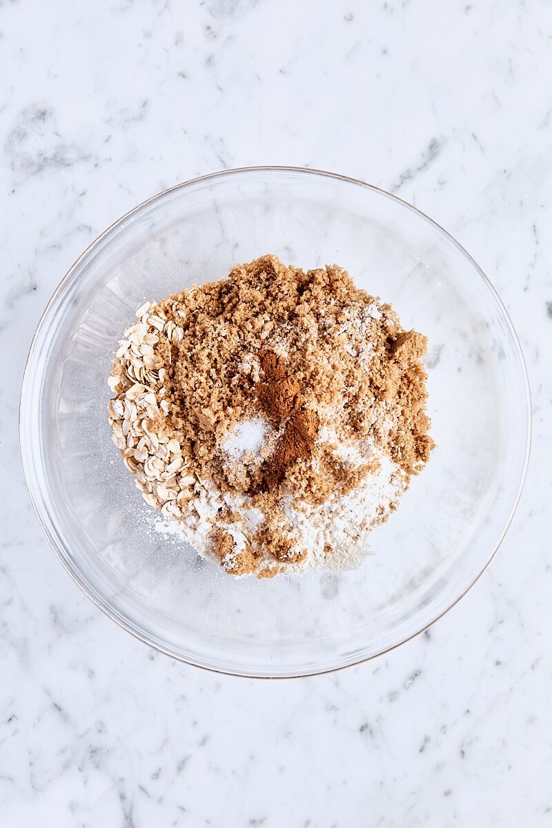 Rolled oats, all-purpose flour, dark brown sugar, cinnamon, and salt in glass bowl