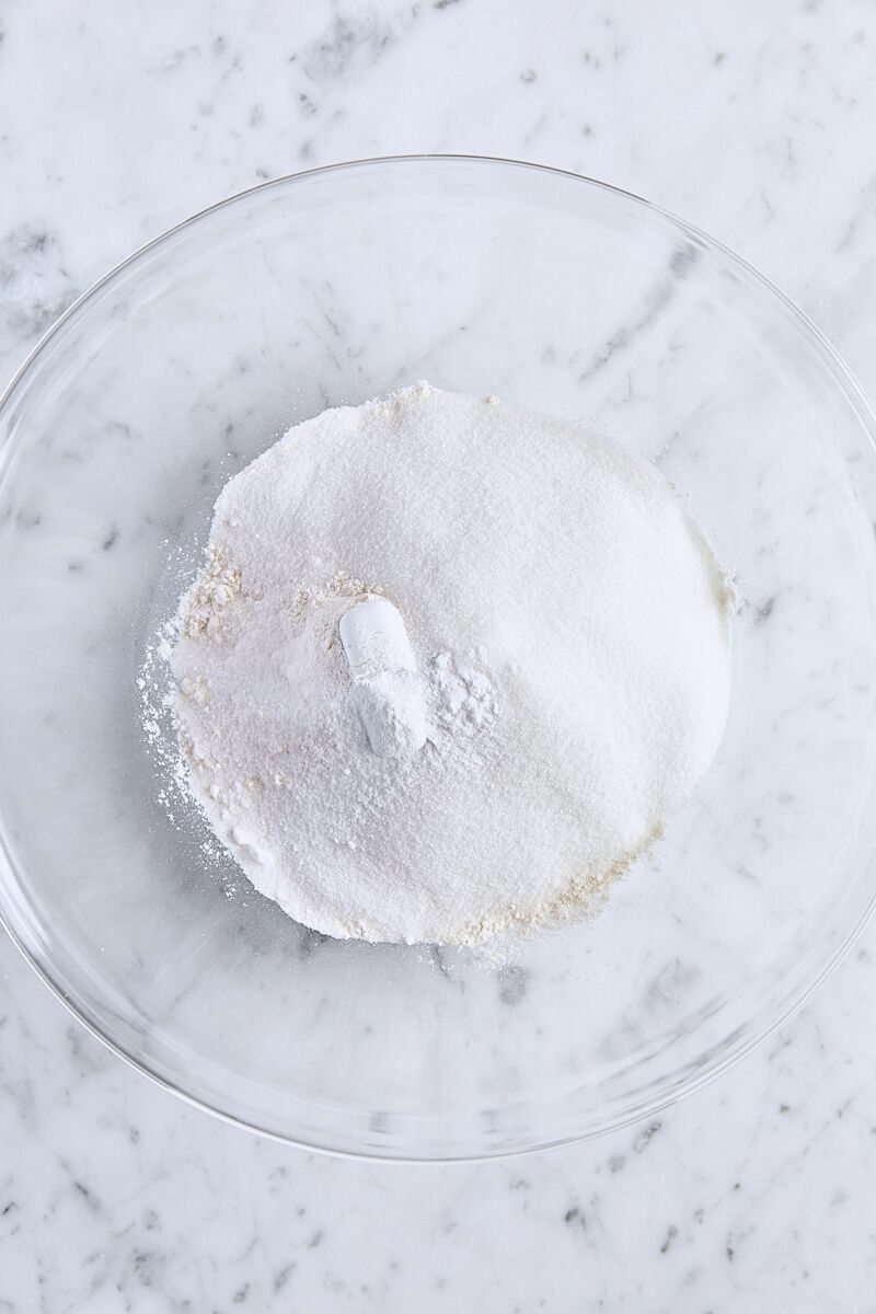 All-purpose flour, granulated sugar, baking powder, baking soda, and salt in large glass bowl